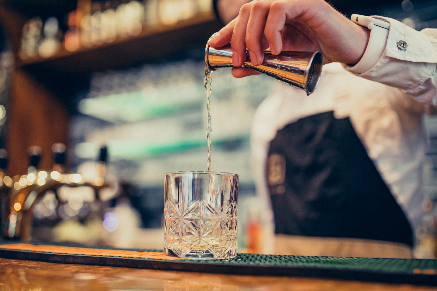 https://brym-uk.com/wp-content/uploads/2023/10/handsome-bartender-making-drinking-cocktails-counter-1-2.jpg