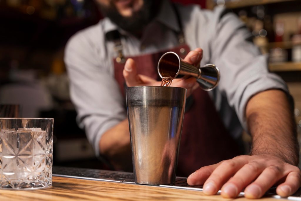 close up bartender cocktail shaker